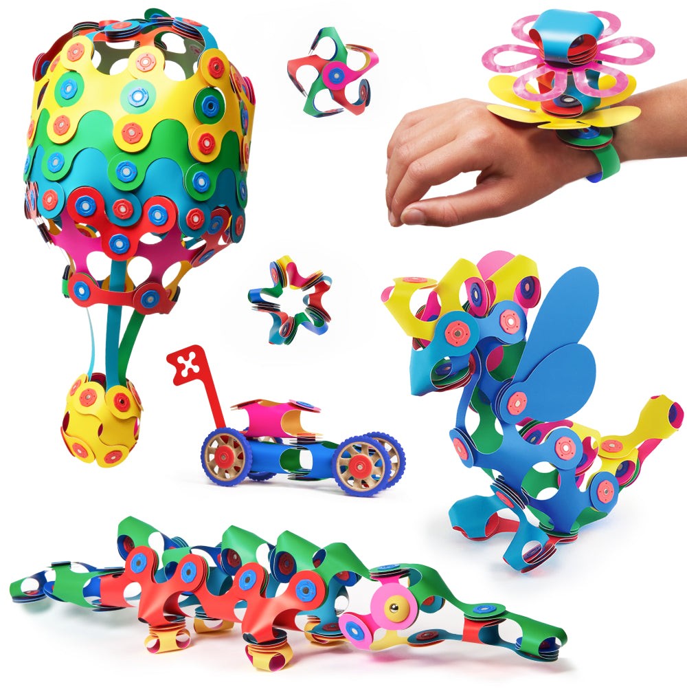 Clixo Family Pack and Expedition Bundle packaging with toy structures in the background.