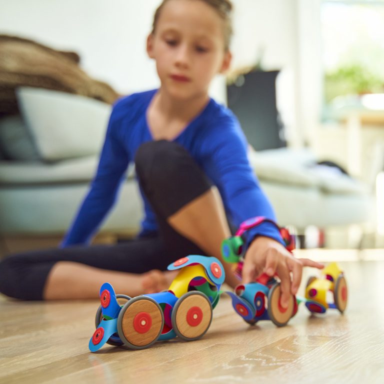 Clixo Wheel Creator Pack with various rolling toy creations made of colorful magnetic pieces.