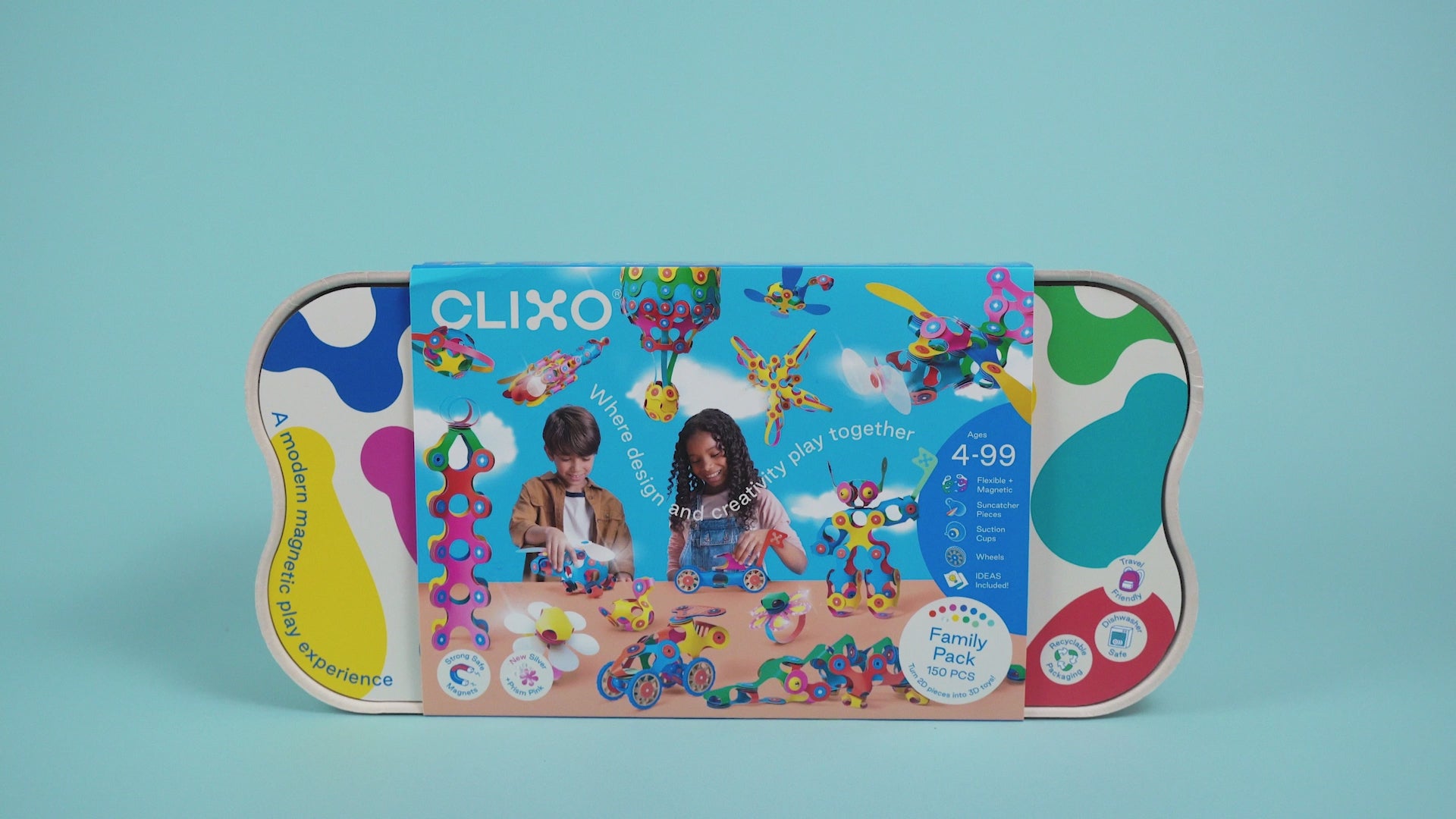Hands assembling a colorful Clixo toy car on a blue background.